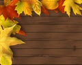 Falling leaves on dark wooden background