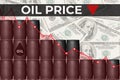 Falling oil price red chart on background of dark barrels dollar bill