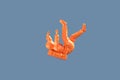 Falling orange astronaut. 3D illustration