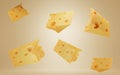 Falling pieces of Swiss, Dutch or Italian hard cheese. Triangular lump block of cheese Cheddar with holes. Advertising Royalty Free Stock Photo