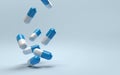 Falling pills on a blue background. Antibiotics.