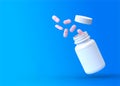 Falling pink pills are spilling from the white pharmacy bottle on a blue background Royalty Free Stock Photo