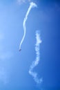 Falling plane on blue sky  background high in the sky, falls down, figure aerobatics The Barrel roll Royalty Free Stock Photo