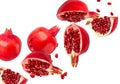 Falling Pomegranate fruit isolated on white background with clipping path, full depth of field. Royalty Free Stock Photo
