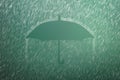 Falling raindrop on green background with Umbrella shape. Heavy rain and weather storm in raining season