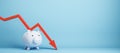 Falling red chart arrow with piggy bank on blue background with mock up place. Economic recession, losing savings concept. Royalty Free Stock Photo