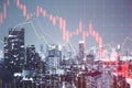 Falling red forex hologram on blurry city background. Stock crisis price drop down chart fall / Stock market exchange analysis or Royalty Free Stock Photo