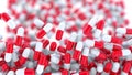 Falling red and white drug capsules or pills, shallow focus. 3D rendering