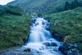 Falling river in the alpine meadows of the Caucasus Mountains