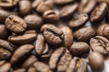 Falling Roasted Coffee Beans, Macro Shot, close-up. Royalty Free Stock Photo