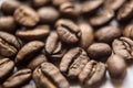 Falling Roasted Coffee Beans, Macro Shot, close-up. Royalty Free Stock Photo