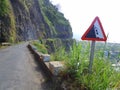 Falling rock road sign on coast road
