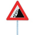 Falling rocks risk caution road sign on pole post, large detailed isolated vertical roadside stones traffic warning signage macro Royalty Free Stock Photo