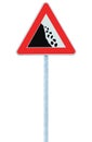 Falling rocks risk caution road sign on pole post, large detailed isolated vertical roadside stones traffic warning signage macro Royalty Free Stock Photo