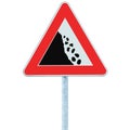 Falling rocks risk caution road sign on pole post, large detailed isolated vertical roadside stones traffic warning signage macro Royalty Free Stock Photo