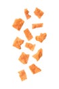 Falling sliced sheets of crispy pork on white background