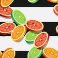 Falling slices of citrus fruits on black and white striped pattern