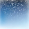 Falling snow on a blue background. Abstract white snowflake and sparkles background. EPS 10 Royalty Free Stock Photo