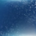 Falling snow on a blue background. Abstract white snowflake and sparkles background. EPS 10 Royalty Free Stock Photo