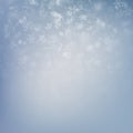 Falling snow on a blue background. Abstract white snowflake and sparkles background. EPS 10 Royalty Free Stock Photo