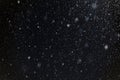 falling snow blurred background, snowflakes against the sky, snowfall in winter Royalty Free Stock Photo