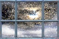 Falling snow outside the window. Royalty Free Stock Photo