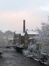 Falling snow over the river calder in the west yorkshire town of hebden bridge Royalty Free Stock Photo