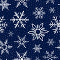 Falling snowflakes on blue background. Seamless pattern snowflake. Design texture winter season for prints. Handdrawn snowflakes. Royalty Free Stock Photo