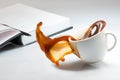 Falling and spilling of a cup of coffee Royalty Free Stock Photo