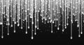 Falling stars, glitter rain, silver star dust, bright white sparkles isolated on a dark background.