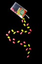 Falling tic tacs isolated on dark background. Royalty Free Stock Photo