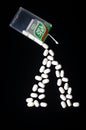 Falling tic tacs isolated on dark background. Royalty Free Stock Photo