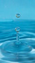 falling water drops on a blue background Royalty Free Stock Photo