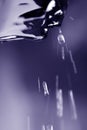 Falling water drops from eaves Royalty Free Stock Photo