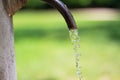 Falling water drops from a standpipe Royalty Free Stock Photo