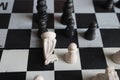 A falling white knight piece in the chess game Royalty Free Stock Photo