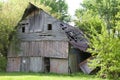 Falling wooden barn Royalty Free Stock Photo