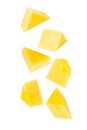 Falling Yellow Mango slices isolated on white background with clipping path, full depth of field.