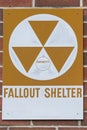 Fallout shelter sign on brick wall