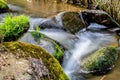 Falls on the small mountain river in a wood Royalty Free Stock Photo