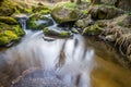 Falls on the small mountain river in a wood Royalty Free Stock Photo