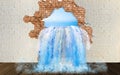Falls from the wall. Water flows from the hole in the wall. Royalty Free Stock Photo