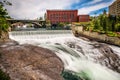 Falls and the Washington Water Power building along the Spokane river Royalty Free Stock Photo