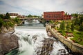 Falls and the Washington Water Power building along the Spokane River Royalty Free Stock Photo