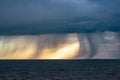 Fallstreaks of rain and hail from a thunderstorm over a lake Royalty Free Stock Photo