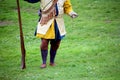 Falmouth, Cornwall, UK - April 12 2018: Historical military re-enactor dressed in blue and yellow Tudor clothes with leather