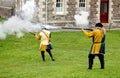 Falmouth, Cornwall, UK - April 12 2018: Historical military re-enactors dressed in blue and yellow Tudor clothes firing genuine 1