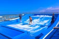 Falmouth, Jamaica - May 02, 2018: Woman surfing on the FlowRider aboard the Oasis of the Seas by Royal Caribbean Royalty Free Stock Photo