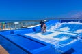 Falmouth, Jamaica - May 02, 2018: Woman surfing on the FlowRider aboard the Oasis of the Seas by Royal Caribbean Royalty Free Stock Photo