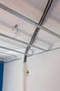 False ceiling installation in progress with metal framing and visible electrical wiring Royalty Free Stock Photo